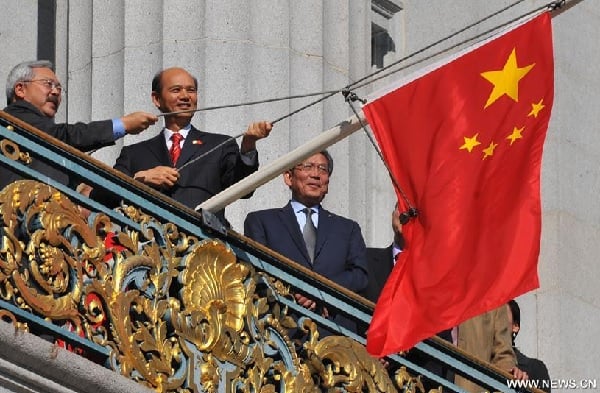 Mayor Ed Lee and PRC consul-general Luo Linquan raise the Chinese flag over San Francisco City Hall (Xinhua, Oct. 1)