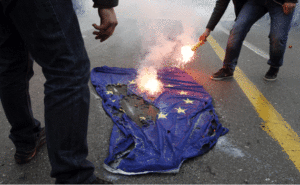 Greek youths burn the European Union flag during a protest, in Athens (Yiorgos Karahalis/ Courtesy Reuters).