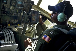 U.S. Coast Guard Lt. Randall Black pilots a helicopter over the Bering Sea to Barrow.