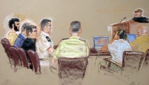 War crimes charges dropped for bin Laden aid and Canadian at Guantanamo.