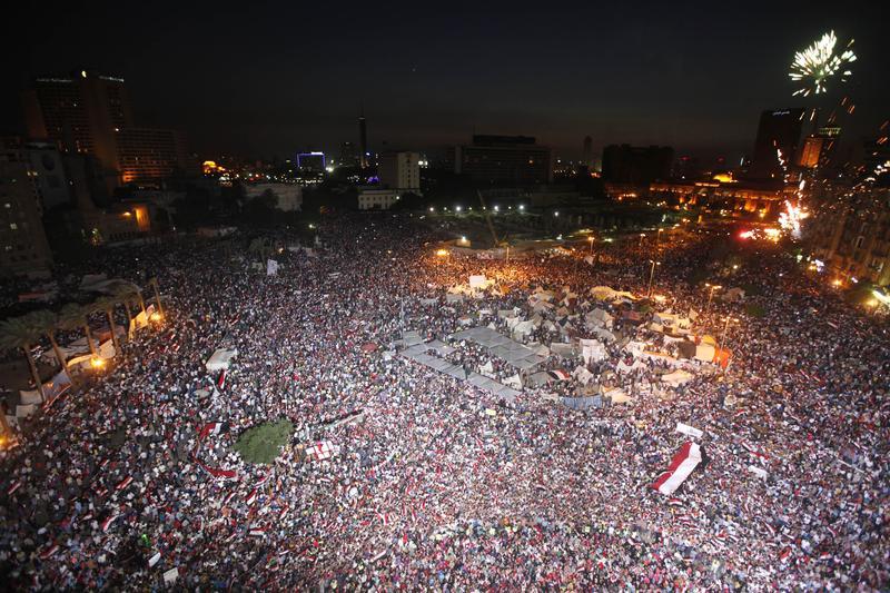 Protesters take part in a protest demanding that Egyptian President Mohamed Mursi resign at Tahrir Square in Cairo