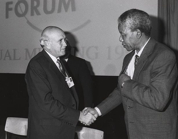 Frederik de Klerk and Nelson Mandela shake hands at the Annual Meeting of the World Economic Forum held in Davos in January 1992. Photo Credit: World Economic Forum 