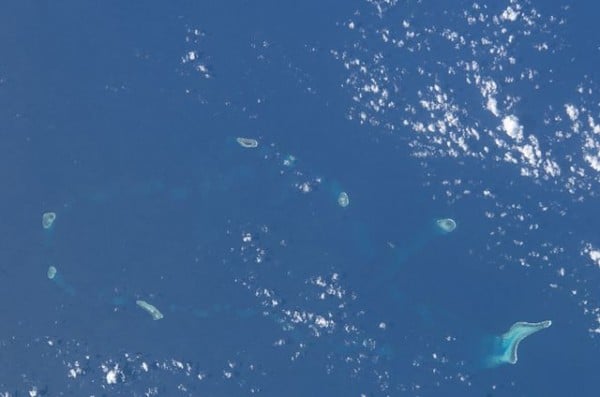 Photograph from the International Space Station of the South China Sea which includes the Eldad Reef and Itu Aba Island features. Photo Credit: Image Science and Analysis Laboratory, NASA-Johnson Space Center