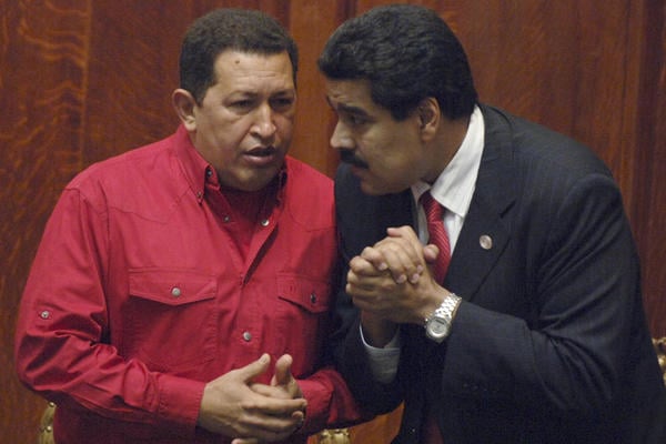 Nicolas Maduro (right) confers with the late Venezuelan President Hugo Chavez in 2007. Maduro will face opposition leader Henrique Capriles Radonski in a special election on Apr. 14, 2013 to choose the next leader of the South American nation. Photo: Matilde Campodonico/AP/File