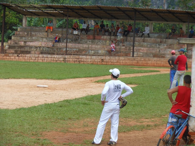 A baseball game, a passion and source of pride for many Cubans, takes place in the town of Vinales, Cuba (Photo: Peter Daerden via Flickr).