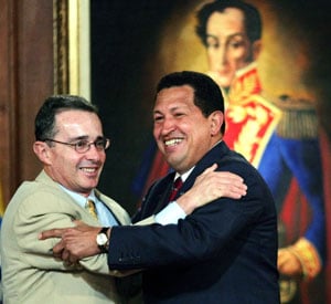 Colombian President Uribe and Venezuelan President Chavez hug, as Latin American Independence hero, Simon Bolivar, looks on.  Source: Google Images