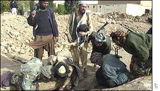 U.N. and Afghanistan investigate mass grave sites. U.N. and Afghanistan investigate mass grave sites.