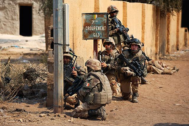 French troops regroup in Gao, Mali on Feb. 21, 2012 as they combat land gains by Islamic militants. Violence in the region continues, with a car bombing in Kidal on Feb. 26; over 430,000 refugees have been displaced. Photo: Joe Penney/Reuters