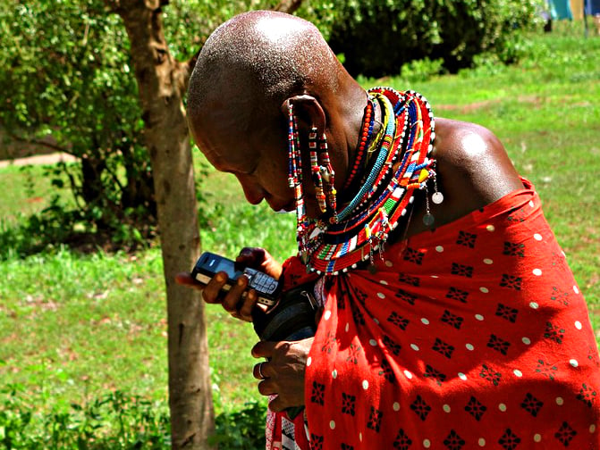 maasai woman with mobile, courtesy University of Denver/flickr (CC BY-NC-SA)