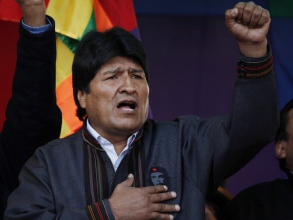 Evo Morales, President of Bolivia, gestures during a parade in La Paz on May 1, 2013. He announced plans to expel the US Agency for Int'l Development from the country, claiming it is conspiring against the Bolivian government. Photo credit: Juan Karita/AP