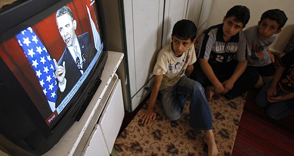 Children watch President Obama's speech in Egypt in 2009. Source: Google Images