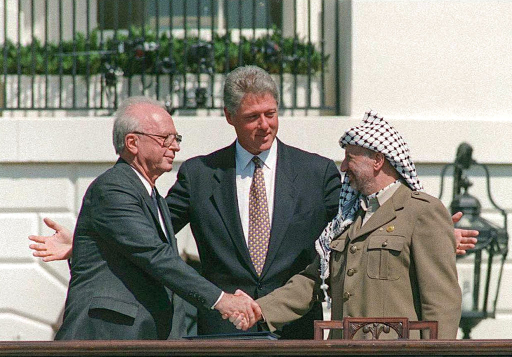 Photo by  /GPO/Israel Sun 13-09-1993PLEASE CREDIT /GPO ONLYWe're coming up on the 20th anniversary of the Oslo AccordsYitzhak Rabin, Bill Clinton, and Yasser Arafat at the Oslo Accords signing ceremony on 13 September 1993 at the White Houseטקס הסכם אוסלו בבית הלבן וושינגטון ארה"ביאסר עראפת לוחץ את ידו של רה"מ יצחק רבין במרכז נשיא ארה"ב ביל קלינטוןצלום ל.ע.מ.     More details Yitzhak Rabin, Bill Clinton, and Yasser Arafat at the Oslo Accords signing ceremony on 13 September 1993