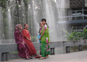 Young women beside a fountain in a park, Tajikistan, July 2009. © Amnesty International