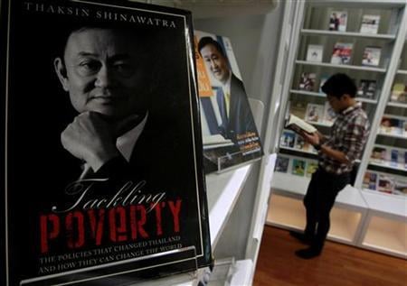 A book about Thailand's former PM Thaksin is displayed at the Puea Thai Party headquarters in Bangkok