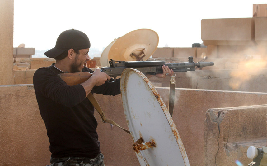 Troops take on Islamist fighters in Benghazi, Libya - Feb 2015 [credit: MOHAMED EL-SHEIKHI/AFP/Getty Images]