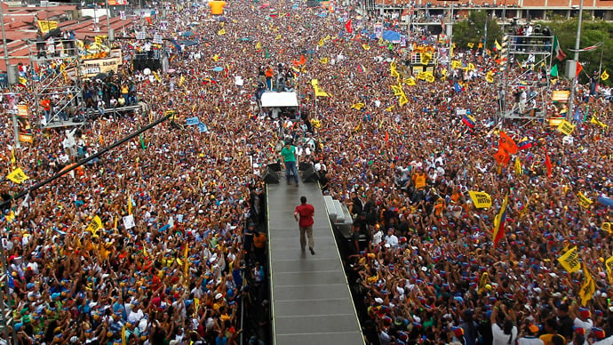 Venezuelan presidential candidate Henrique Capriles, at center in red shirt, takes the stage at a campaign rally, April 2013. State officials say Capriles was narrowly defeated by Nicolas Maduro on Apr. 14, but Capriles is demanding a recount. Photo: Reuters / Carlos Garcia Rawlins 